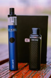 A vape and its battery are placed on the table