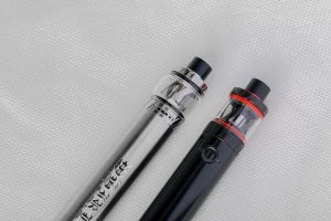 Two vapes of different colors lined up together